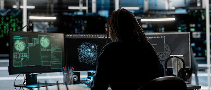 Industrial cybersecurity whitepaper by Nidec Drives Data centre expert monitoring network traffic patterns detecting cybersecurity threats